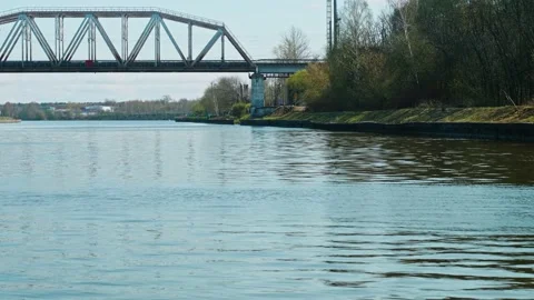 Approaching to bridge. View from sailing boat. Spring nature in Russia Stock Footage 153995076
