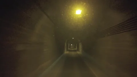 Approaching a Bright Tunnel Exit with Passing Lights Stock Footage 341860982