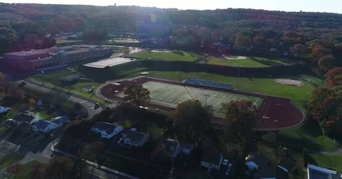 Approaching Bristol Central High school football field and zooming in on logo Stock Footage 82326454
