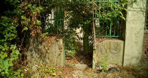 Approaching the Broken Front Gate of an Abandoned House in Italy DCI 4K Stock Footage 202291262