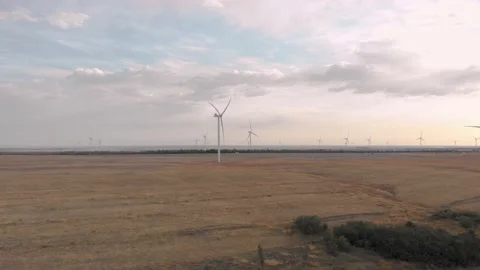Approaching the camera to the wind turbine 4K Video stock 207809211