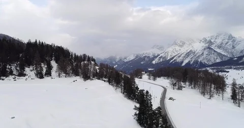 Approaching a car driving down a high moutain road. Stock Footage 92684290