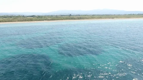 Approaching the coast while a cyclist is passing Stockbeeldmateriaal 116533044