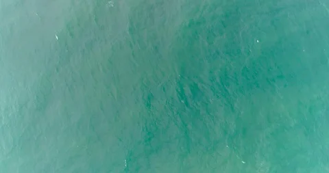 Approaching the coastline of the sea with storm waves and a rocky cliff. Storm Stock Footage 128197397