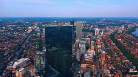 Approaching the dark glossy skyscraper towering over the picturesque cityscape. Stock Footage 340279232