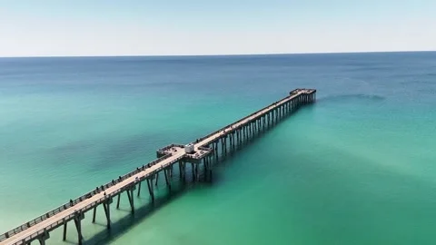 Approaching drone movement to a pier endpoint stretching into the clear and Video stock 307822702