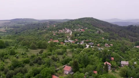 Approaching drone shot moving above the neighborhood of Tsarichina Hole Stock Footage 264779161