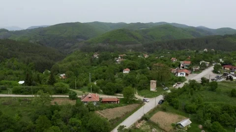 Approaching drone shot moving slowly towards the village of Tsarichina and Stock Footage 263707029