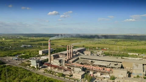 Approaching factory chimneys, contributing to air pollution and harming the Видео 302254599