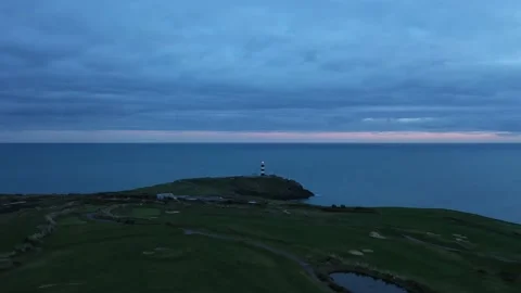 Approaching the flashing lighthouse. Old Head Lighthouse, West Cork, Ireland 4K Stock Footage 234143745