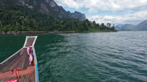 Approaching Floating Bungalows by Longtail Boat Stock Footage 329073691