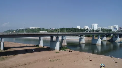 Approaching frame of the bridge with road and machine. Highway transportation. Stock Footage 127794935