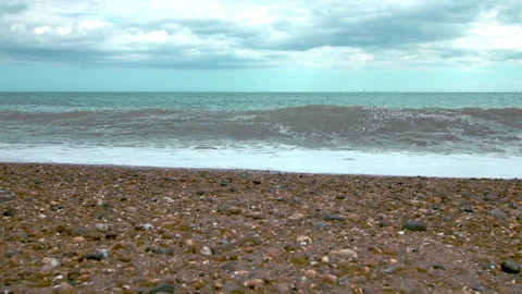 Approaching from the ground to the waves of the ocean. Stock Footage 134609166