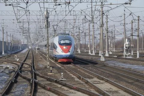 Approaching high-speed train EVS1-20 "Sapsan". Oktyabrskaya Railway Stock Photos