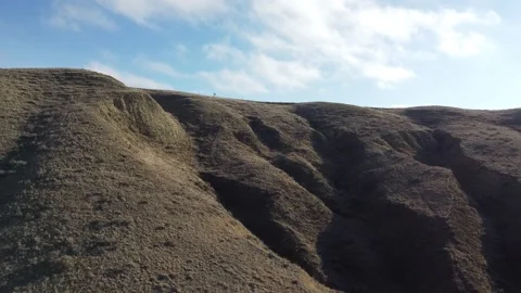 Approaching Hill with Deep Crevaces Stock Footage 217407956