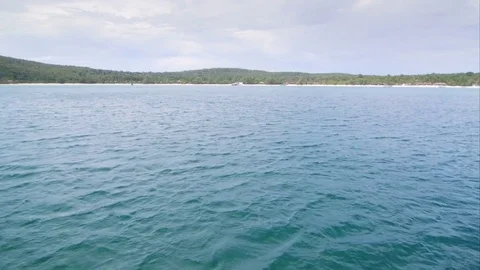 Approaching an island with boat Stock-Footage 76554928
