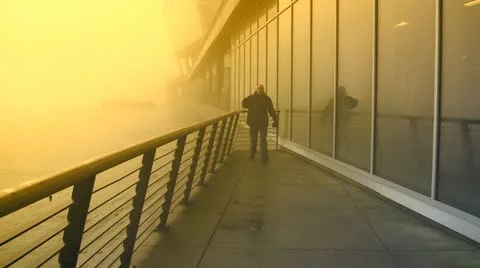 Approaching Man Outside Yellow Mist Soaked Building Stock Footage 19118959