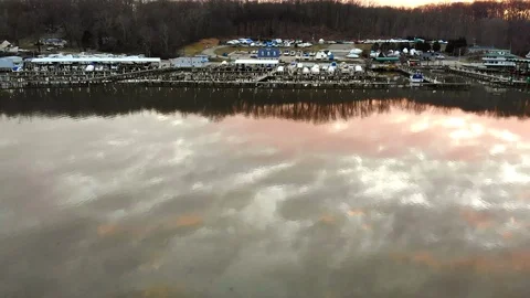 Approaching Marina over reflection murky water 動画素材 104011155