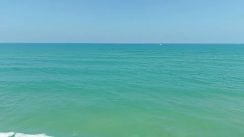 Approaching the Ocean on a Sunny Beach Stock Footage 308669836