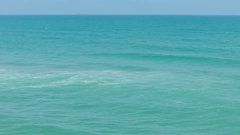 Approaching the Ocean on a Sunny Beach Stock Footage 308669926