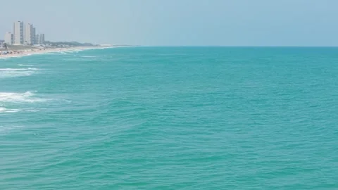 Approaching the Ocean on a Sunny Beach Stock Footage 308669927