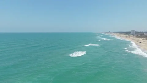 Approaching the Ocean on a Sunny Beach Stock Footage 308669933