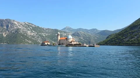 Approaching Our Lady of the Rocks on a boat Stock Footage 344088400