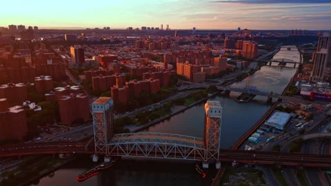 Approaching the Park Avenue Bridge spanning the Harlem River. Setting sun lights Stock Footage 343445839