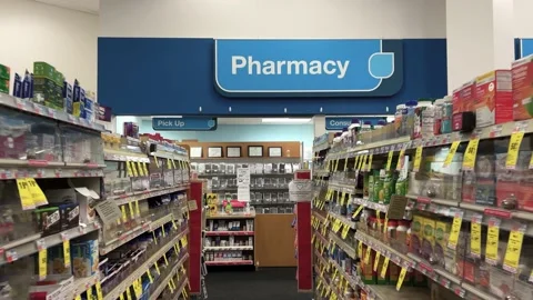 Approaching pharmacy in store aisle Stock Footage 148127023