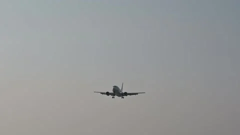 Approaching plane in the sky, airplane flying over head in the daytime. Stock Footage 168372397