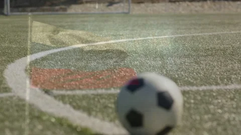 Approaching player shadow kicking ball sending it rolling along arc to camera Stock Footage 333485947
