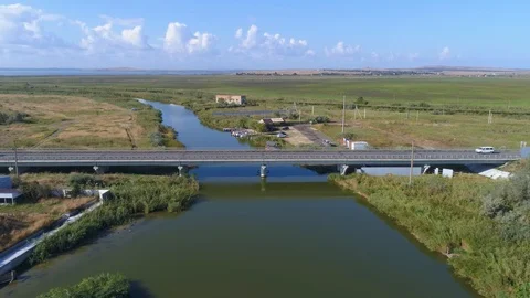 Approaching the road bridge across the river. Stock Footage 98760348