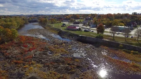 Approaching a Small Town on a River from the Air Stock Footage