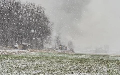 Approaching Stem Passenger Train, in a Snow Storm, Blowing Black and White Smoke Stock Photos