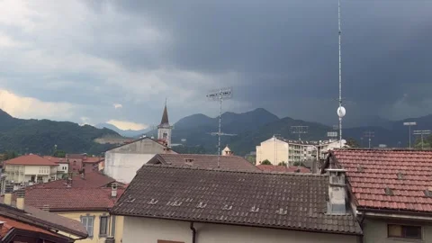 Approaching Thunderstorm Over Mountain Town with Dramatic Dark Clouds. Stock Footage 339313253