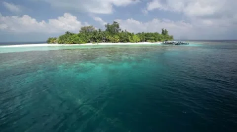Approaching tiny island Stock Footage 10788759