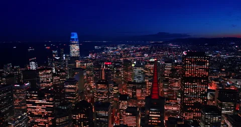 Approaching the top of the Transamerica Pyramid colored red at night. Gorgeous Stock Footage 332245131