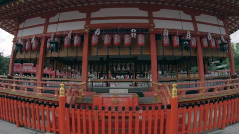 Approaching Traditional Shrine with Red Lanterns in Kyoto, Japan Stock Footage 341636690