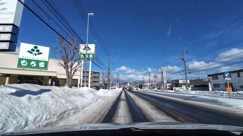 Approaching traffic queue on wet road in Hakodate winter city Video stock 333069460
