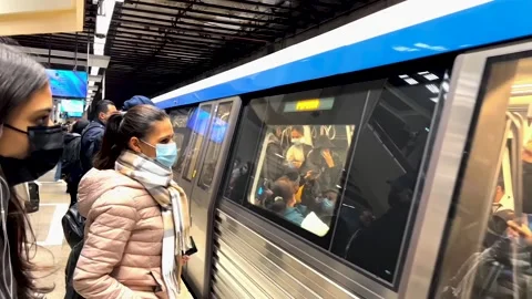 Approaching train, passengers at platform. Stock Footage 279805576