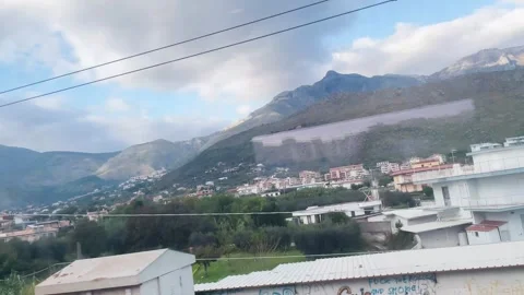 Approaching the Train Stop by the Mountains Stock Footage 274775247