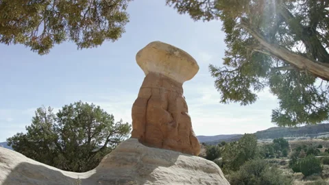 Approaching unique red rock hoodoo tower in Devil’s Garden, Escalante Utah Stock Footage 248580624