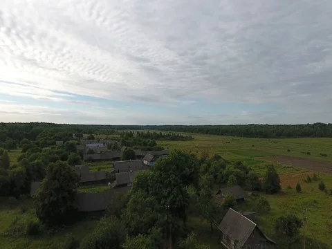 Approaching the village on a cloudy day at low altitude Stock Footage 70313799