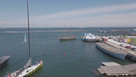 Approaching a World War II era historic sailboat in harbor Stock Footage 82376237