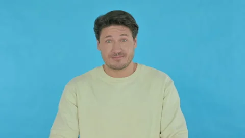 Approval by Young Man, Shaking Head on Blue Background 库存影片 230503797