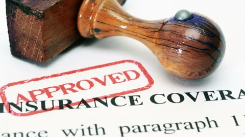 Approved Insurance Coverage Document with Rubber Stamp Stock Footage 334894040
