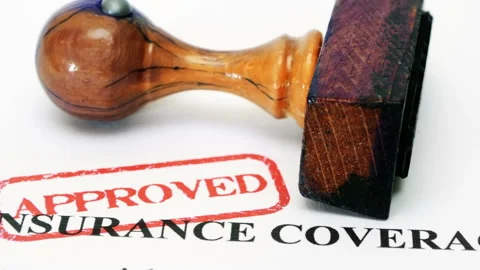 Approved Insurance Coverage Document with Wooden Rubber Stamp Stock Footage 334490446