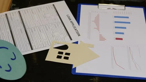 Approved loan application concept. Smiley over the documents Stock Footage 257967978