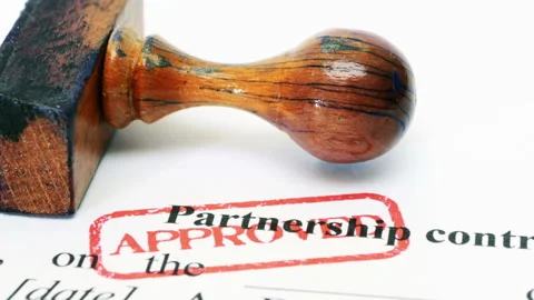 Approved Partnership Contract Document with Wooden Stamp Close-Up Stock Footage 335104077