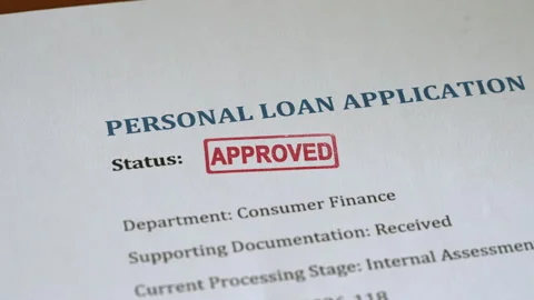 Approved Stamp Coming Down on Personal Loan Application Form Stock Footage 340655219